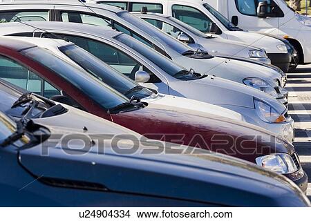 Row of parked cars View Large Photo Image Picture - Row of parked cars. Fotosearch