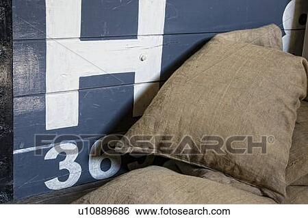 Sacks piled in front of wooden crate View Large Photo Image Stock Photograph - Sacks piled in front of wooden crate. Fotosearch
