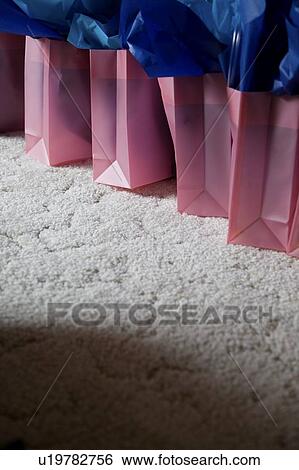 Shopping bags in a row View Large Photo Image Stock Photograph - Shopping bags in a row. Fotosearch