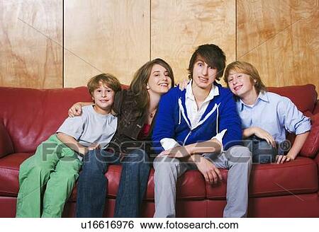 Siblings on a couch View Large Photo Image Stock Photograph - Siblings on a couch. Fotosearch