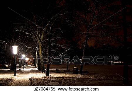 Stock Photography - Sidewalk at night in the winter. Fotosearch