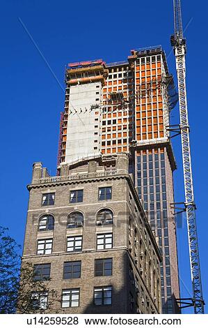 Skyscraper construction on 5th Avenue, Midtown Manhattan, New York City, New York, USA View Large Photo Image Stock Photo - Skyscraper construction on 5th Avenue, Midtown Manhattan, New York City, New York, USA . Fotosearch