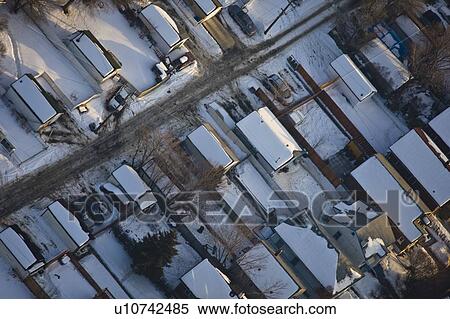 Snow covered houses in residential suburb View Large Photo Image Stock Photography - Snow covered houses in residential suburb. Fotosearch