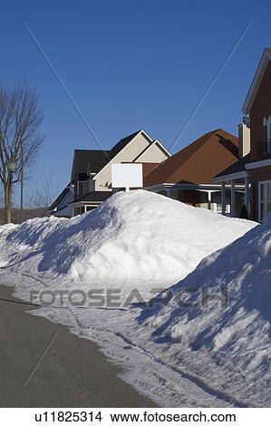 Snow piled on edge of street View Large Photo Image Picture - Snow piled on edge of street. Fotosearch