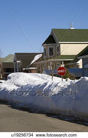 Picture - Snow piled on edge of street. Fotosearch