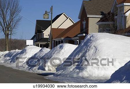 Stock Image - Snow piled on edge of street. Fotosearch