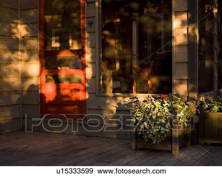 Stock Photo - Sunset on the porch. Fotosearch