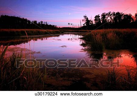 Sunset over river View Large Photo Image Picture - Sunset over river. Fotosearch
