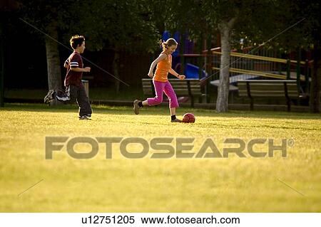 Two kids playing soccer View Large Photo Image Stock Photography - Two kids playing soccer. Fotosearch