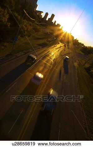 Vehicles moving on a road View Large Photo Image Stock Photo - Vehicles moving on a road. Fotosearch