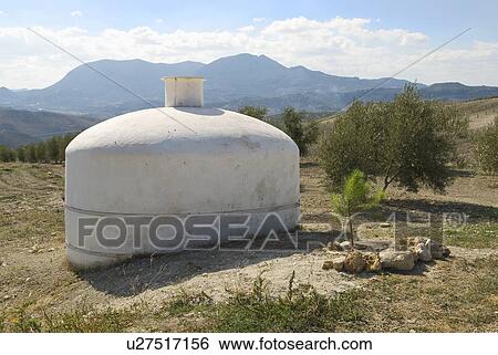 Water deposit for olive trees View Large Photo Image Stock Photograph - Water deposit for olive trees. Fotosearch