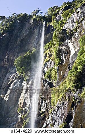 Waterfall in Milford Sound, New Zealand View Large Photo Image Stock Photo - Waterfall in Milford Sound, New Zealand. Fotosearch