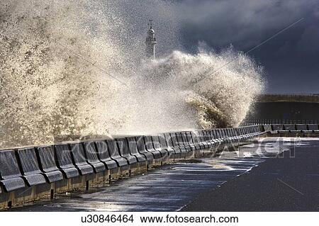 Waves crushing against barrier, Sunderland, Tyne and Wear, England View Large Photo Image Picture - Waves crushing against barrier, Sunderland, Tyne and Wear, England. Fotosearch