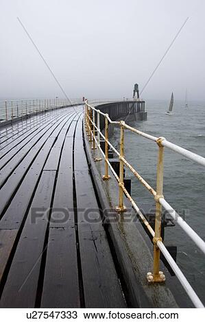 Stock Image - Whitby, North Yorkshire, England, Pier. Fotosearch