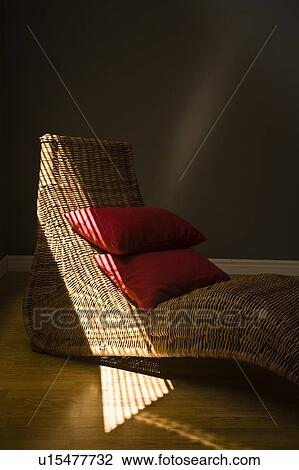 Wicker lounging chair with red pillows View Large Photo Image Stock Image - Wicker lounging chair with red pillows. Fotosearch
