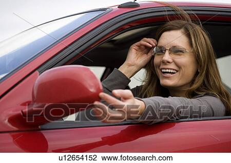 Woman in her car View Large Photo Image Stock Image - Woman in her car. Fotosearch