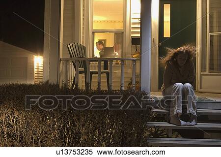 Woman sitting outside of her house View Large Photo Image Stock Photography - Woman sitting outside of her house. Fotosearch