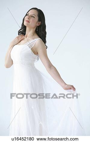 Stock Image - Woman wearing flowing dress. Fotosearch