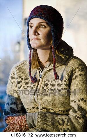 Stock Image - Woman wearing toque and sweater. Fotosearch