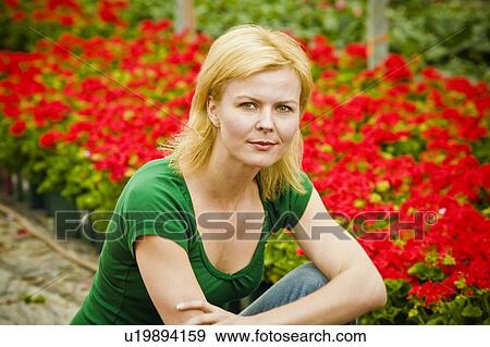 Woman with flowers View Large Photo Image Stock Photo - Woman with flowers. Fotosearch