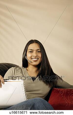 Woman with wireless head set View Large Photo Image Stock Image - Woman with wireless head set. Fotosearch