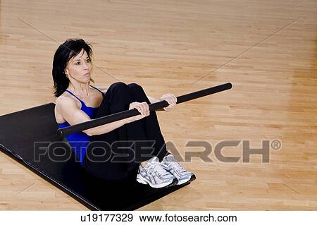 Stock Photo - Woman working out. Fotosearch