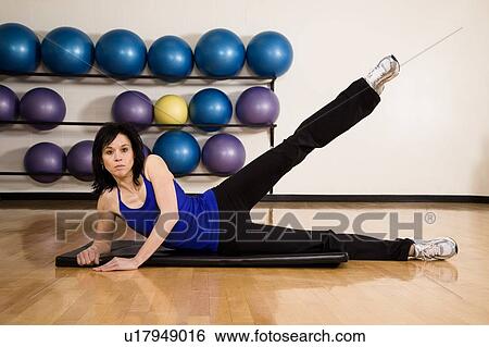 Woman working out View Large Photo Image Stock Photograph - Woman working out. Fotosearch