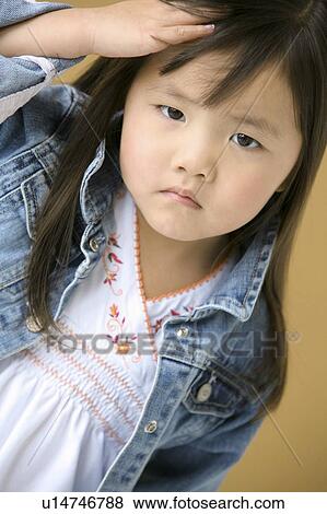 Young girl frowning View Large Photo Image Stock Photo - Young girl frowning. Fotosearch