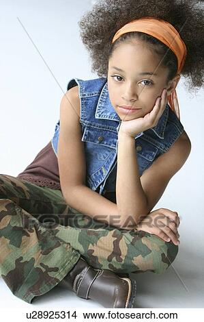 Picture - Young girl in urban outfit. Fotosearch