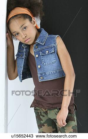 Stock Image - Young girl in urban outfit. Fotosearch