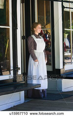 Young woman standing in store doorway View Large Photo Image Stock Image - Young woman standing in store doorway . Fotosearch