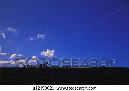 A tractor on the horizon View Large Photo Image Stock Photography - A tractor on the horizon. Fotosearch