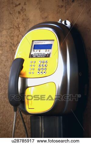 Stock Photo - A yellow pay phone Vatican City Rome Italy. Fotosearch