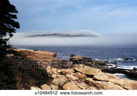 Stock Image - Acadia National Park, Maine, USA; Low lying on the water. Fotosearch