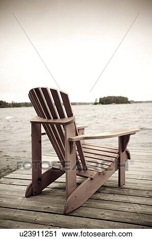 Adirondack chair on deck, Muskoka, Ontario, Canada View Large Photo Image Stock Image - Adirondack chair on deck, Muskoka, Ontario, Canada. Fotosearch