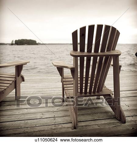 Adirondack chairs on deck, Muskoka, Ontario, Canada View Large Photo Image Picture - Adirondack chairs on deck, Muskoka, Ontario, Canada. Fotosearch