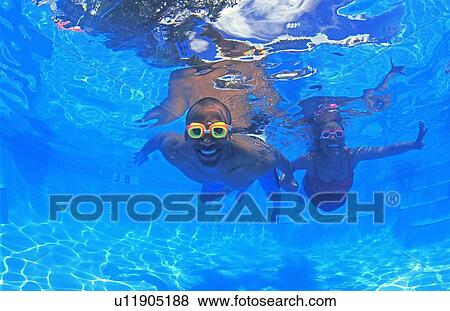 Adult couple in swimming pool View Large Photo Image Stock Photo - Adult couple in swimming pool. Fotosearch
