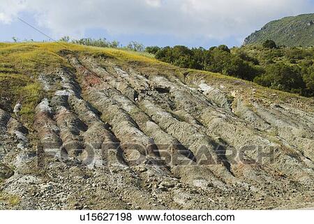 Stock Photo - Andalucia, Spain; Craters created in landscape by heavy rainfall on mountain side. Fotosearch