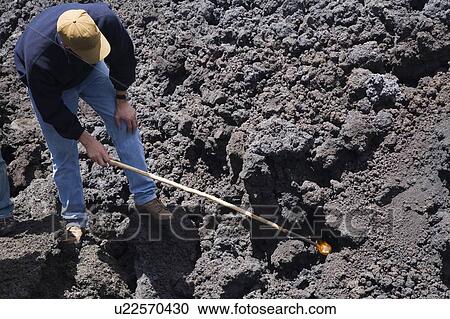 Antigua, Guatemala, Central America; Man with a stick pointed at lava View Large Photo Image Stock Image - Antigua, Guatemala, Central America; Man with a stick pointed at lava. Fotosearch