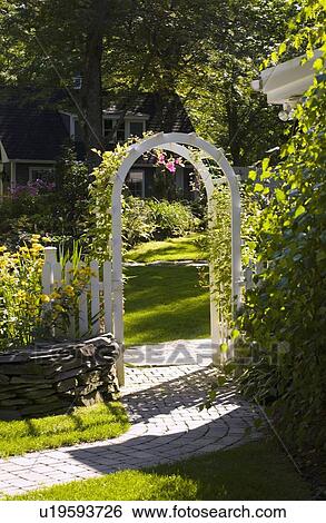 Stock Photograph - Archway into yard. Fotosearch