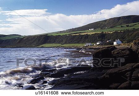 Stock Photo - Arran, Scotland, United Kingdom; Houses dotting the rugged coastline, . Fotosearch
