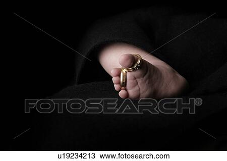Baby's foot with wedding rings of parents View Large Photo Image Stock Image - Baby's foot with wedding rings of parents . Fotosearch