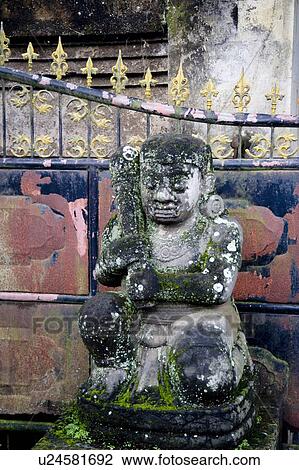 Stock Image - Bali, Indonesia, Asia; Weathered statue. Fotosearch
