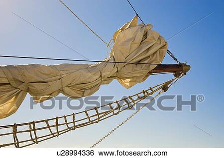Stock Photograph - Bowsprit; front of sailing yacht shown against a blue sky. Fotosearch