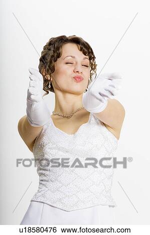 Stock Photograph - Bride asking for a kiss. Fotosearch