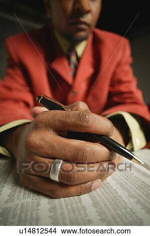 Businessman reading the journal View Large Photo Image Picture - Businessman reading the journal. Fotosearch