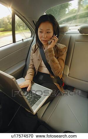 Stock Image - Businesswoman on the cell phone. Fotosearch