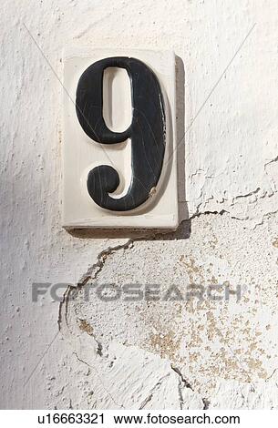 Ceramic number nine on whitewashed wall View Large Photo Image Stock Image - Ceramic number nine on whitewashed wall. Fotosearch