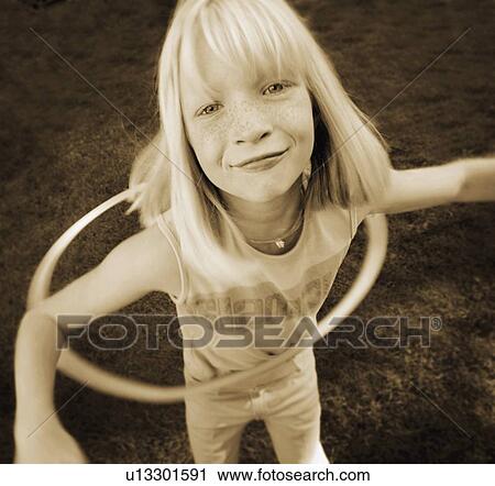 Child plays with hoop View Large Photo Image Stock Image - Child plays with hoop. Fotosearch