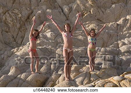 Stock Image - Children in bathing suits, Los Cabos, Mexico . Fotosearch